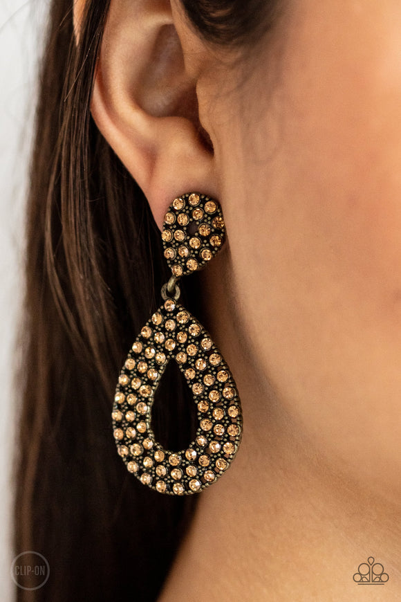 Pack In The Pizzazz - Brass Clip-On Earrings - Paparazzi Accessories
